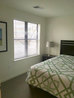 Washington apartment for rent - a bedroom with a bed and a window