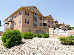 Lansing apartment for rent - an apartment building with a sign in front of it