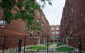 Chicago apartment for rent - A courtyard surrounded by brick buildings.