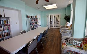 Melbourne apartment for rent - a dining room with a long table and chairs
