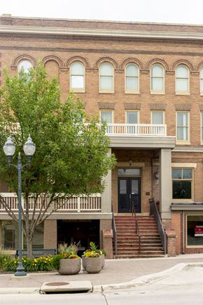 Spirit Lake apartment for rent - A large building with a tree in front of it.