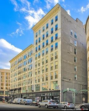 Milwaukee apartment for rent - a tall building with cars parked in front of it