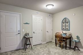 Elizabeth City apartment for rent - a dining room with two doors and a table with chairs