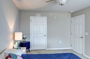 Hickory apartment for rent - a bedroom with a bed and two closet doors