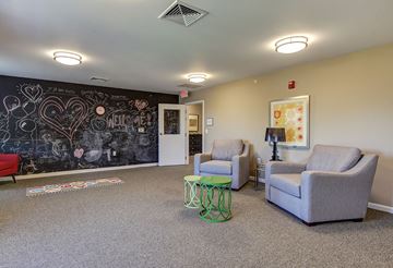 Hickory apartment for rent - a living room with a chalkboard wall and couches
