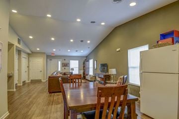 Keyser apartment for rent - a dining room and living room with a table and refrigerator