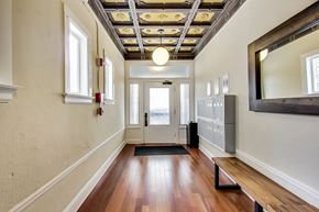 San Francisco apartment for rent - A hallway with a wooden floor and a ceiling with lights.