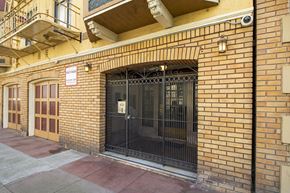 San Francisco apartment for rent - A black gate is on a brick wall.