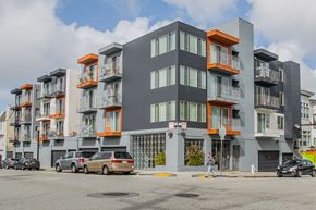San Francisco apartment for rent - A modern apartment building with orange accents on the balconies.