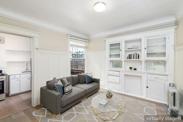 San Francisco apartment for rent - A living room with a grey couch and a coffee table.