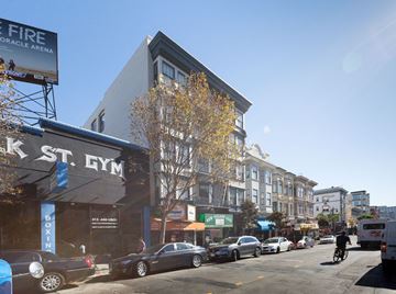 San Francisco apartment for rent - A street view of a city with a gym and a fire arena advertisement.