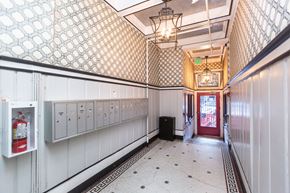 San Francisco apartment for rent - A hallway with a red door at the end.