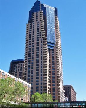 Stpaul apartment for rent - A tall building with a blue sky in the background.