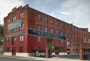 Petersburg apartment for rent - a large brick building with a sign on the side of it