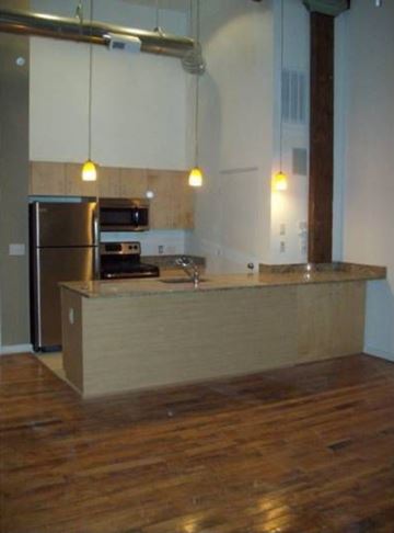 Petersburg apartment for rent - a kitchen with a counter top and a refrigerator