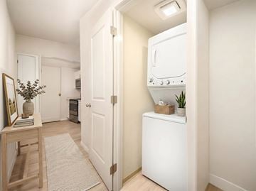 Seattle apartment for rent - A white kitchen with a fridge, oven and microwave.