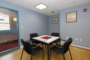 New Bedford apartment for rent - a game room with a table and chairs