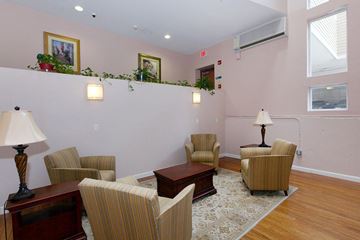 New Bedford apartment for rent - a living room with chairs and a table