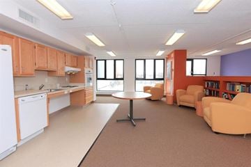 Boston apartment for rent - a living room and kitchen with furniture and a table