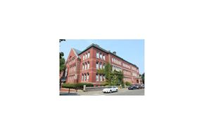 Gloucester apartment for rent - a large brick building on the corner of a street