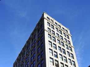 Boston apartment for rent - a tall building with a blue sky in the background