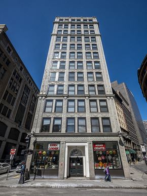 Boston apartment for rent - a tall building on the corner of a city street