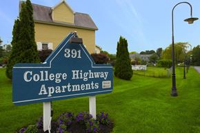 Easthampton apartment for rent - a sign for college highway apartments in front of a house
