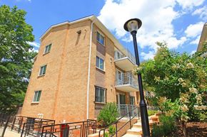 Washington apartment for rent - a brick apartment building with stairs and a street light