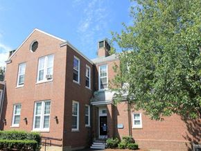 Lexington townhouse for rent - a red brick house with a tree in front of it