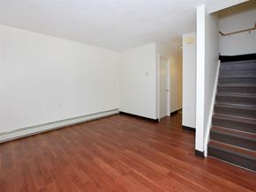 Lexington townhouse for rent - a living room with a hard wood floor and stairs