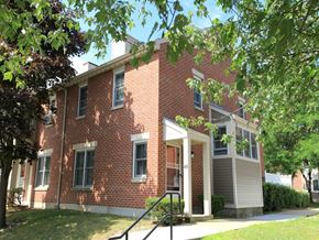 Lexington townhouse for rent - a red brick building with a tree in front of it