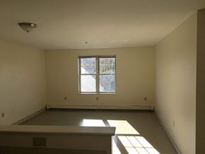 Somerville apartment for rent - the living room of a house with a large window
