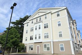 Somerville apartment for rent - a tall building with a street light in front of it