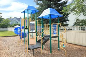 Somerville apartment for rent - a playground with a blue and yellow swing set