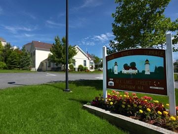 Chatham apartment for rent - a sign in the grass in front of a street