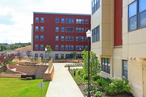 Washington apartment for rent - a walkway between two buildings on the campus of a university