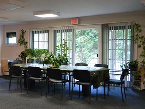 New Haven apartment for rent - a dining room with a table and chairs and plants