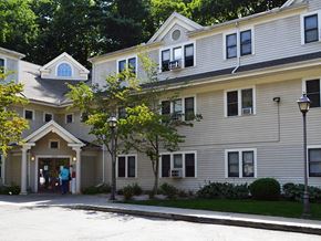 New Haven apartment for rent - a large house with a person standing in the front door