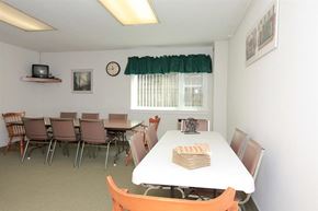Jamaica Plain apartment for rent - a dining room with a white table and chairs