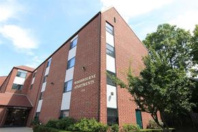 Jamaica Plain apartment for rent - a brick building with a tree in front of it