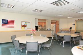 Westfield apartment for rent - a dining room with tables and chairs and an flag