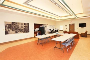 Cohoes apartment for rent - a large room with tables and chairs and a living room
