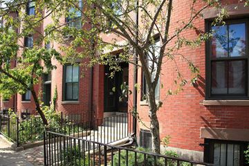 Boston apartment for rent - a red brick building with a tree in front of it