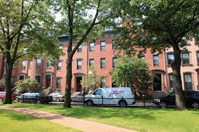 Boston apartment for rent - a van parked in front of a brick building