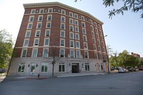 Troy apartment for rent - a large brick building on the corner of a street