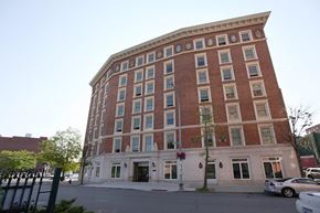 Troy apartment for rent - a large brick building on the corner of a street