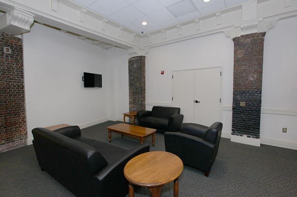 Troy apartment for rent - a living room with couches and a table