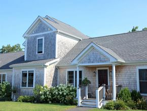 Edgartown apartment for rent - a white house with a gray roof and a porch