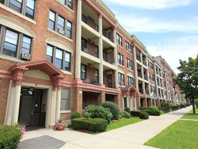 Dorchester apartment for rent - a sidewalk in front of a brick apartment building