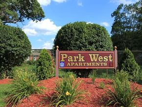 Vernon apartment for rent - a park west apartments sign in front of trees